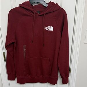 North face Burgundy Sweater with styled message, front and back.